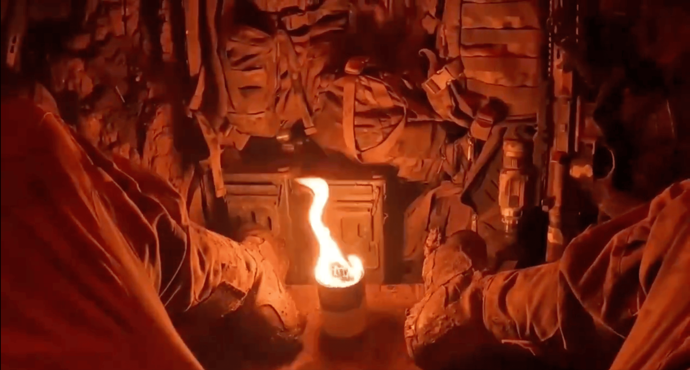 Screengrab from a video from the Ukrainian National Guard showing the use of a trench candle by Ukranian soldiers. 