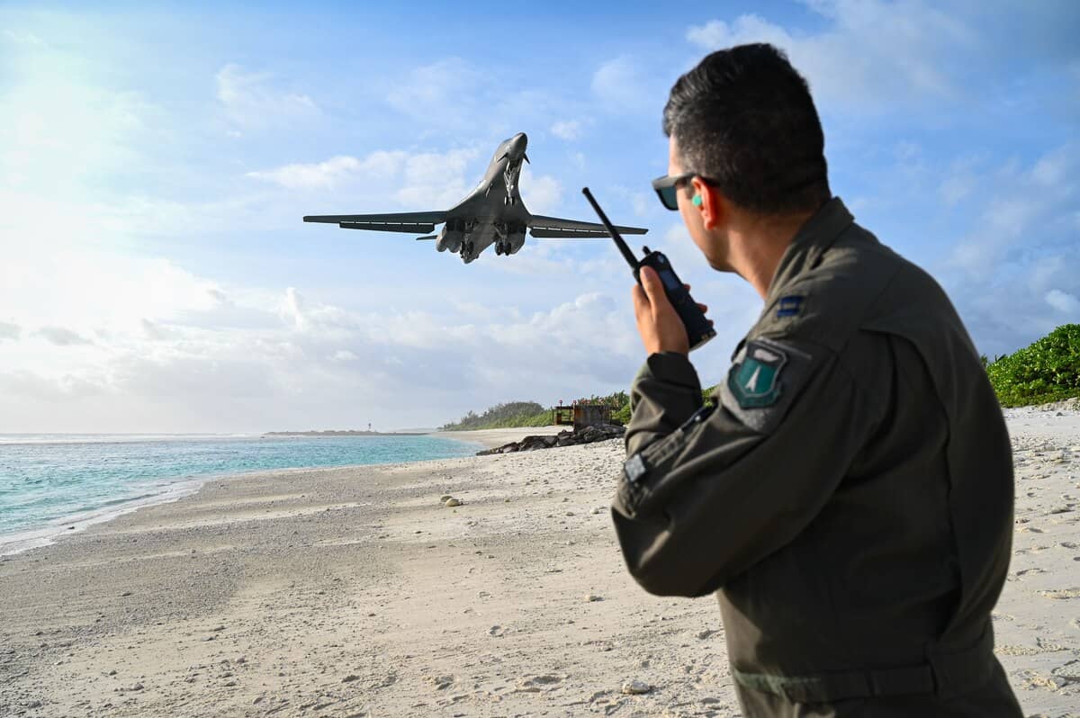 U.S. Air Force Capt. Orr "Recoil" Genish, 37th Bomb Squadron WSO, watches a B-1B Lancer land during a Bomber Task Force mission at Naval Support Facility Diego Garcia, Oct. 17, 2021. (U.S. Air Force by Staff Sgt. Hannah Malone)