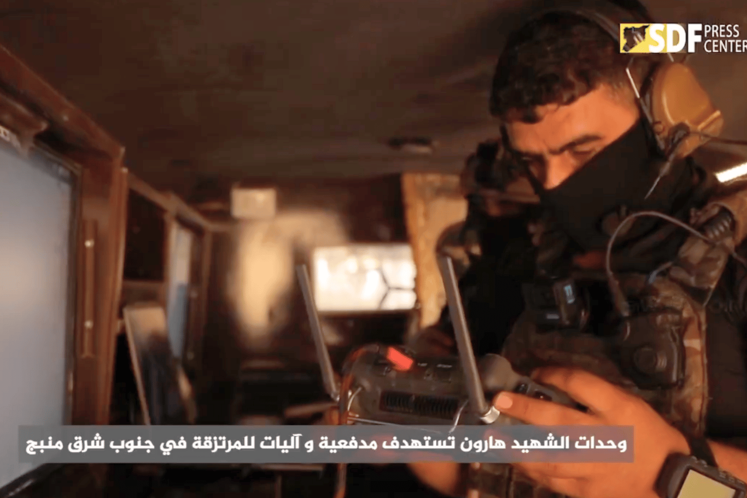 Screenshot from the Syrian Democratic Forces Press Center showing a drone operator utilizing FPV Kamikaze Drones armed with PG-7VT Tandem-HEAT RPG's.