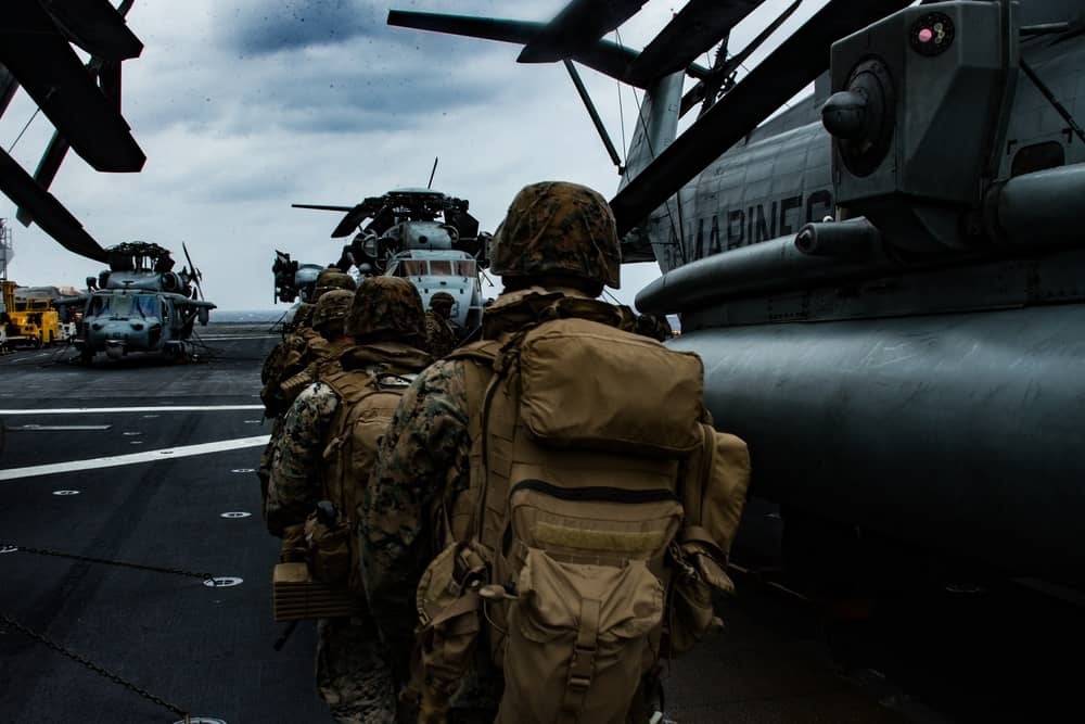 Marines with Battalion Landing Team, 1st Battalion, 5th Marines, 31st Marine Expeditionary Unit (MEU), prepare to board a CH-53E Super Stallion heavy-lift helicopter during a quick reaction force rehearsal (U.S. Marine Corps photo by Lance Cpl. Kolby Lege