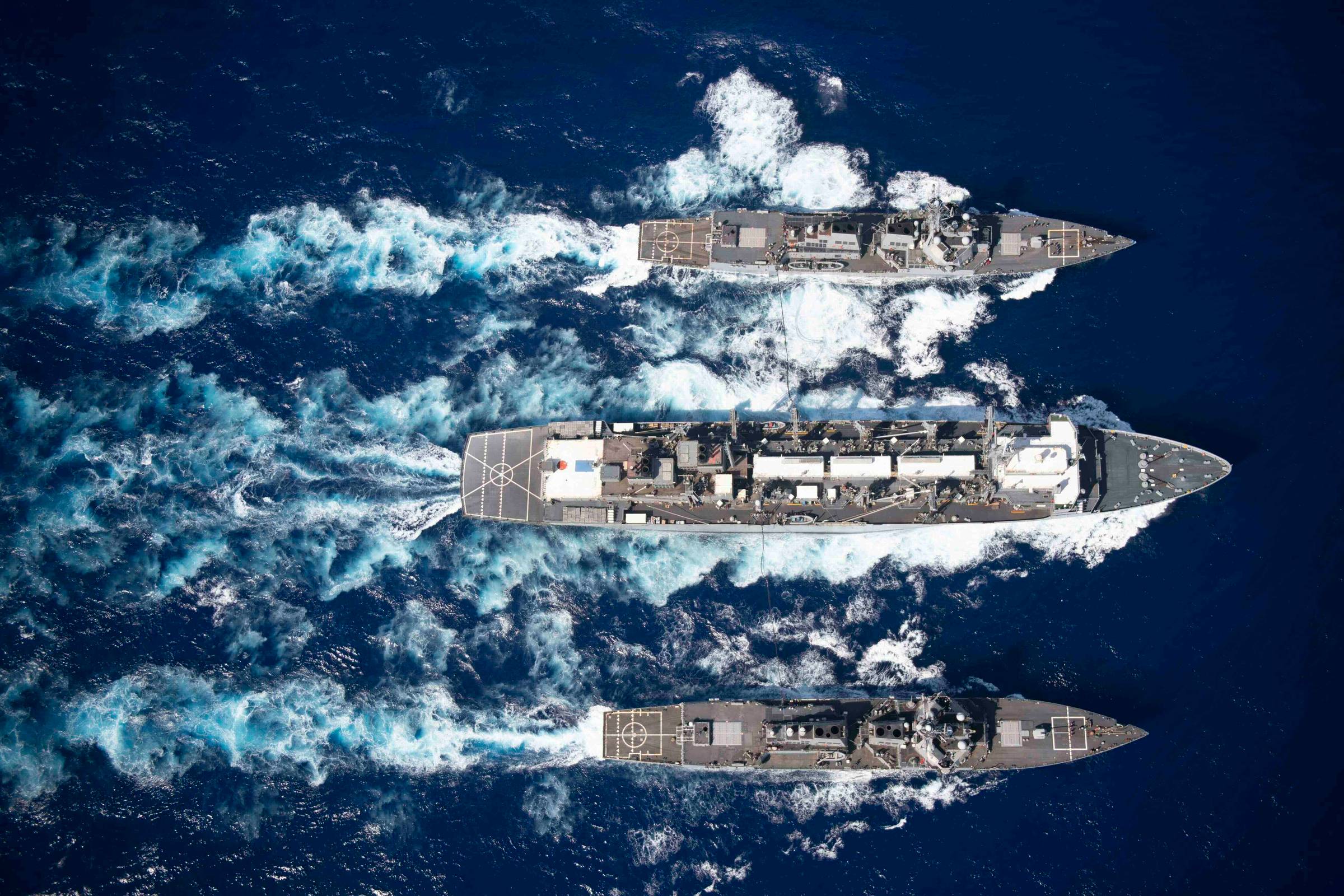 From top to bottom, the guided-missile destroyer USS Gravely (DDG 107), the fast combat support ship USNS Supply (T-AOE 6), and the guided-missile destroyer USS Forrest Sherman (DDG 98) (U.S. Navy photo by Mass Communication Specialist 3rd Class Rebekah M