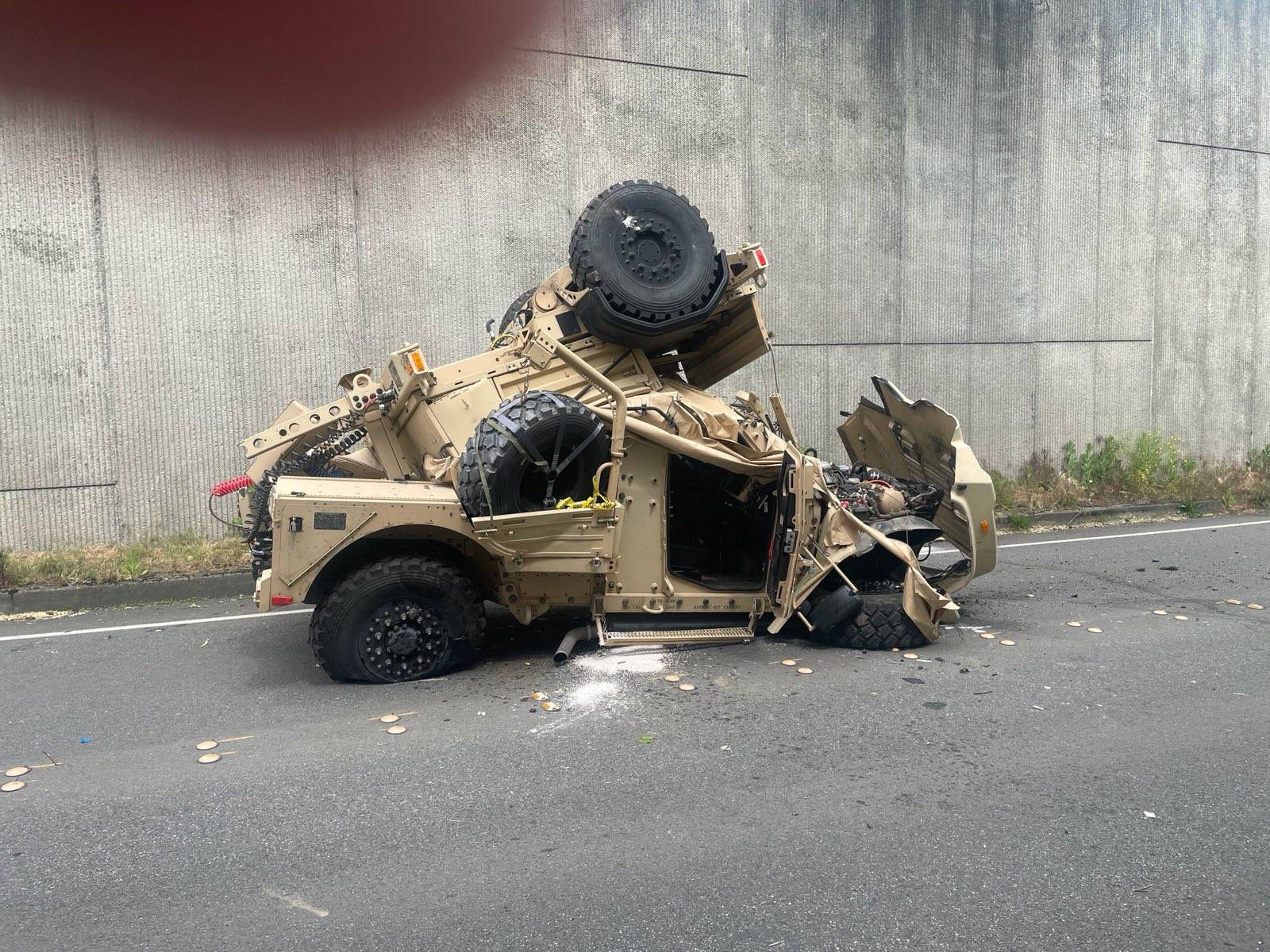 A military Humvee towing a trailer drove off Interstate 90 in Bellevue, Washington (Photo: Washington State Patrol Trooper Rick Johnson / Via X) 