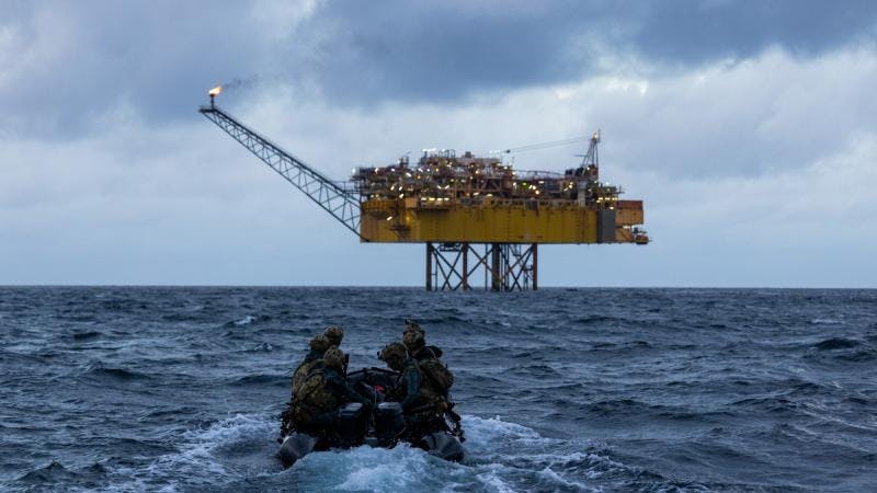 Australian Army soldiers from Special Operations Command pilot a Zodiac small boat to offshore energy infrastructure