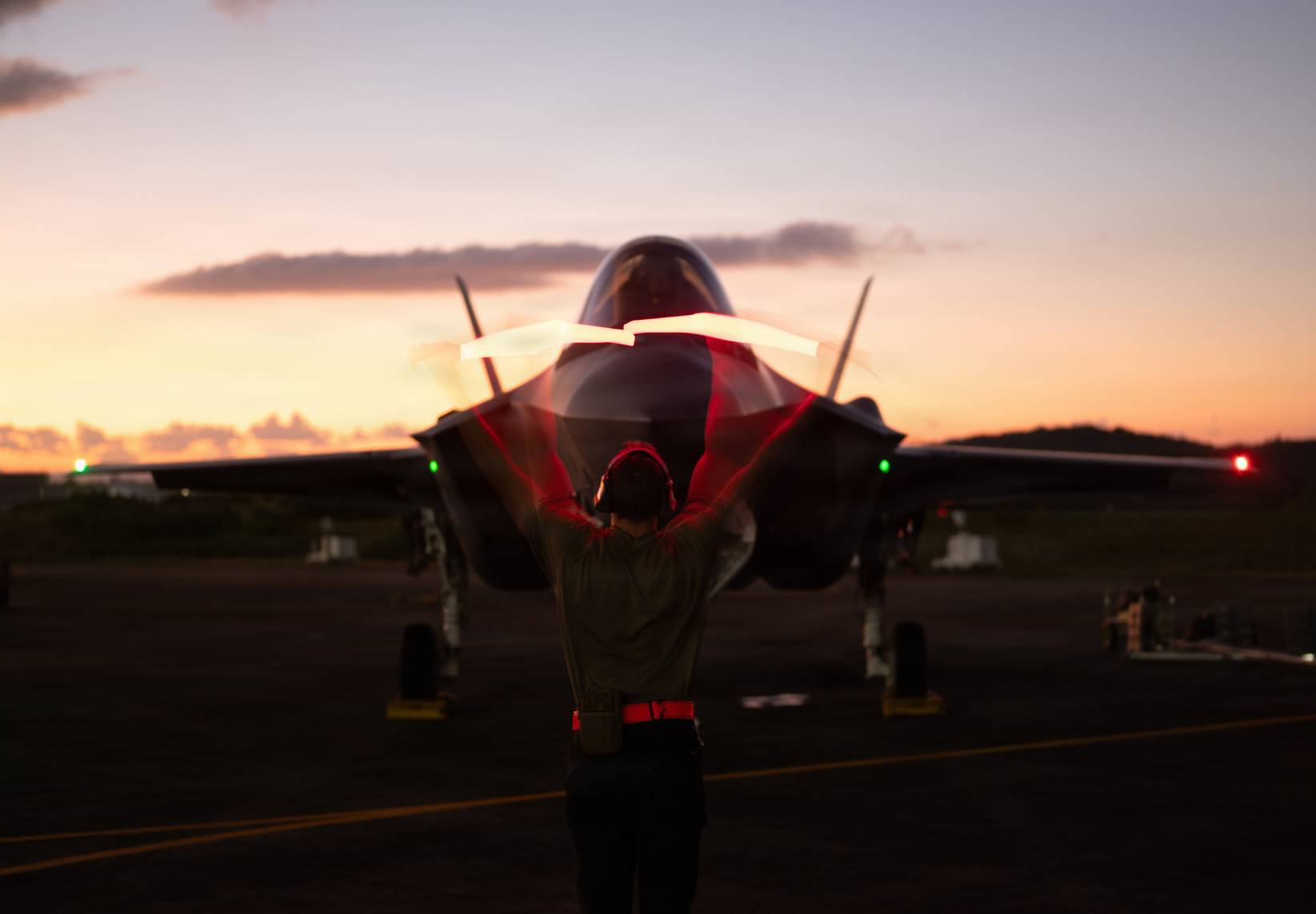 A U.S. Air Force crew chief marshals an F-35A Lightning II following military actions against Venezuela in support of Operation Absolute Resolve, Jan. 3, 2026.(U.S. Air Force Photo) 