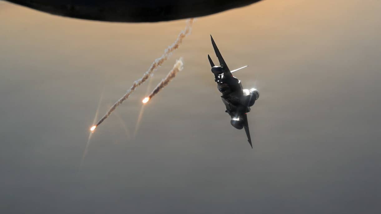 A U.S. Air Force F-15E Strike Eagle aircraft deploys flares after refueling from a U.S. Air Force KC-135 Stratotanker aircraft in the U.S. Central Command area of responsibility Aug. 19, 2026. (U.S. Air Force photo by Master Sgt. James K. Thomas)