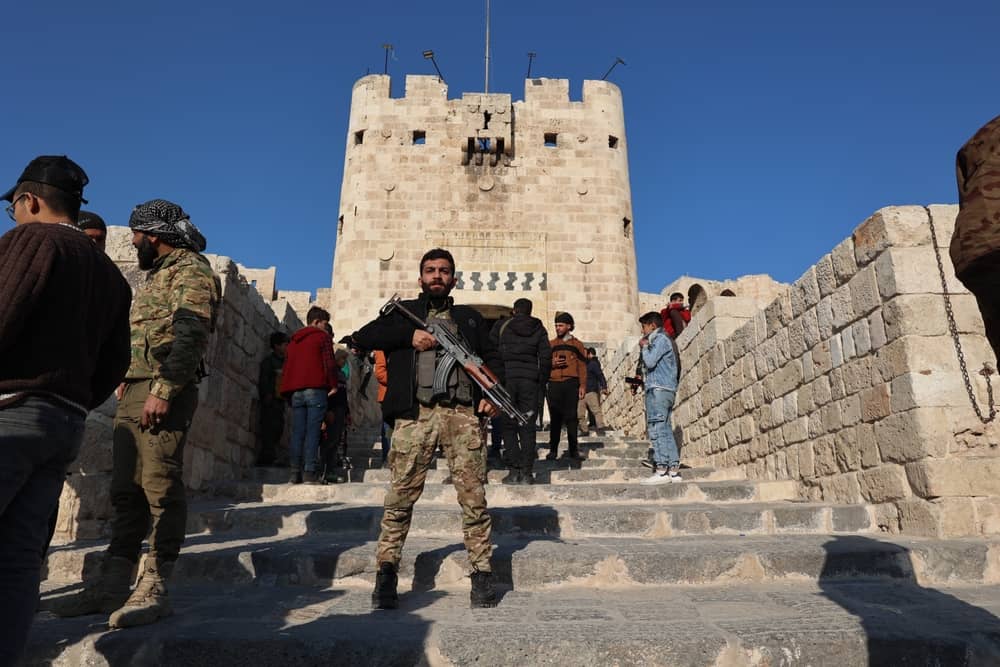 Syria security forces present at the infamous Aleppo citadel following the overtrhow of the Assaf Regime (Mohammad Bash / Shutterstock.com)