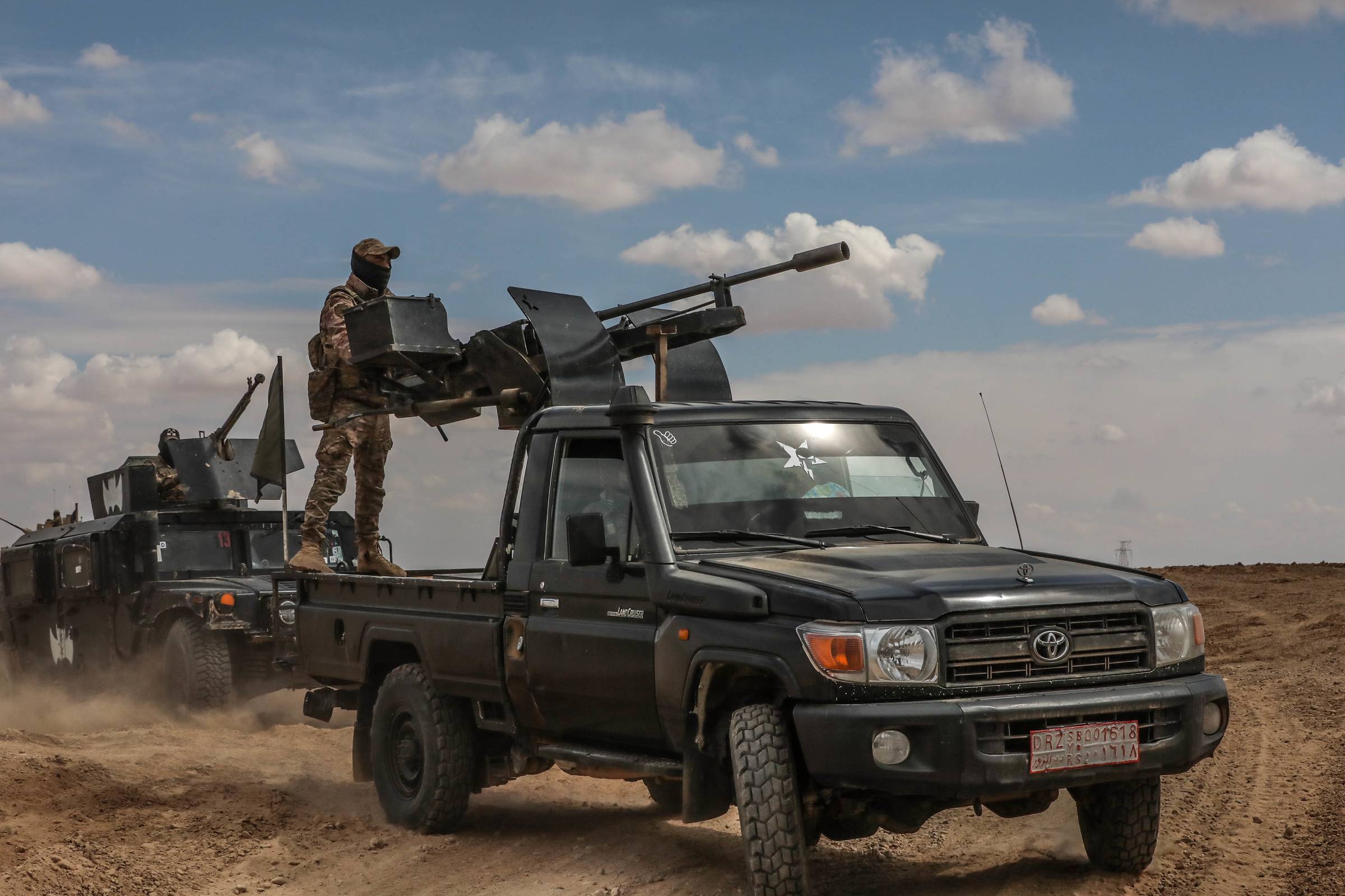 Syrian Defense Forces (SDF) conduct a live fire exercise alongside U.S Soldiers in Syria on March 25, 2022.  (U.S. Army photo by Spc. William Gore)