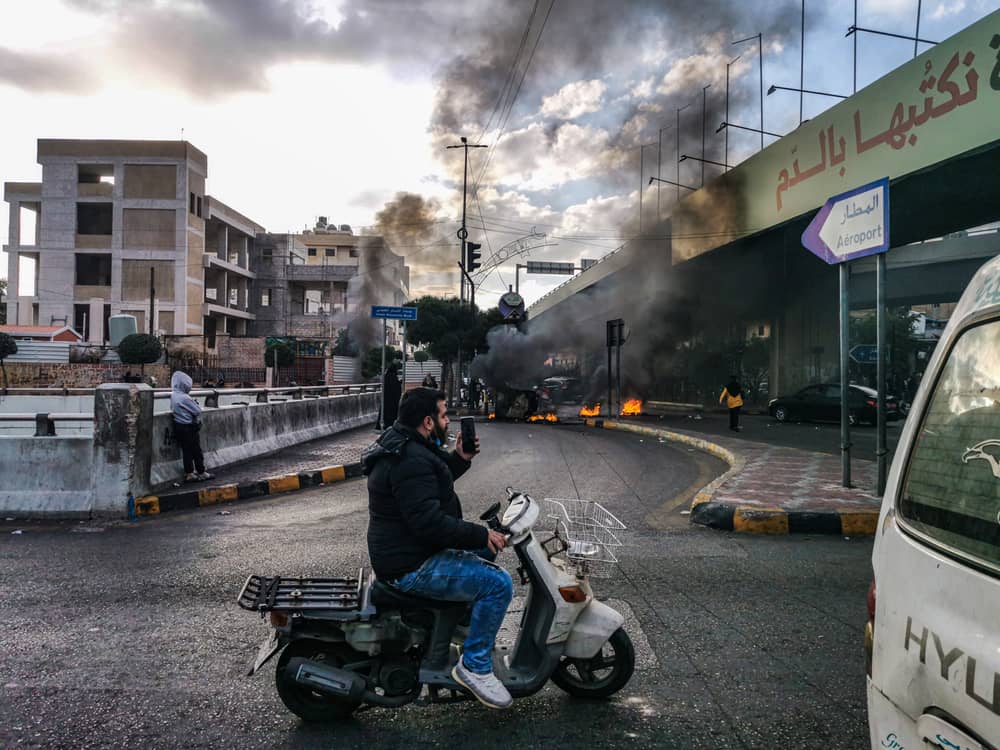 Lebanese Protesters Burning Tires on Airport Highway cutting the Road.