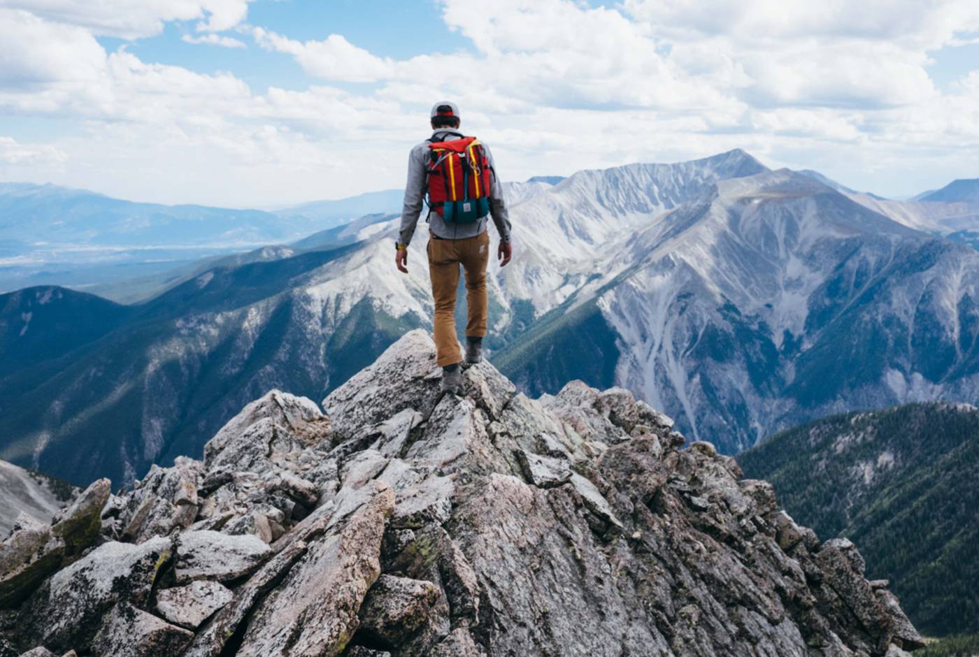 a man standing on top of a mountain