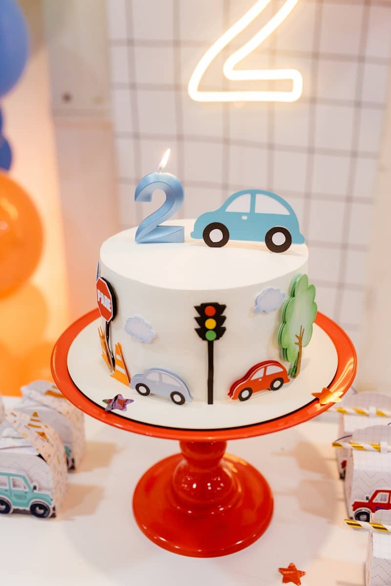 A two-year-old's birthday cake is decorated.