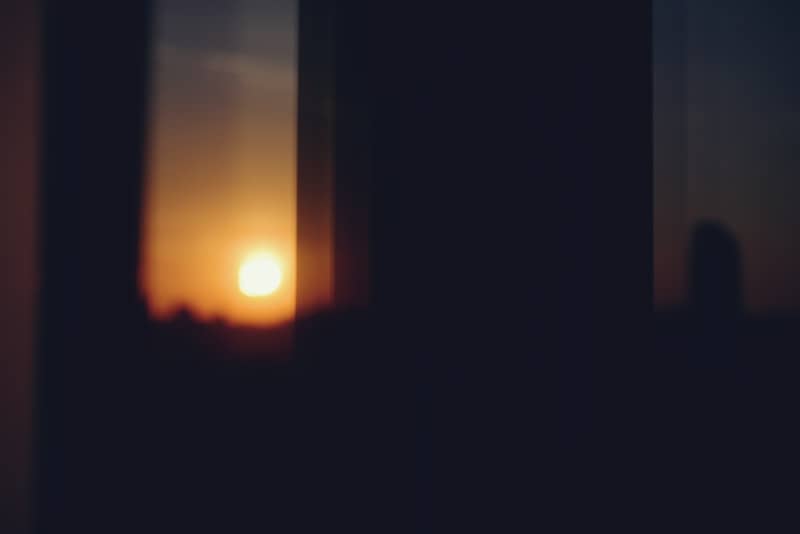 Sunset seen through dark window frames