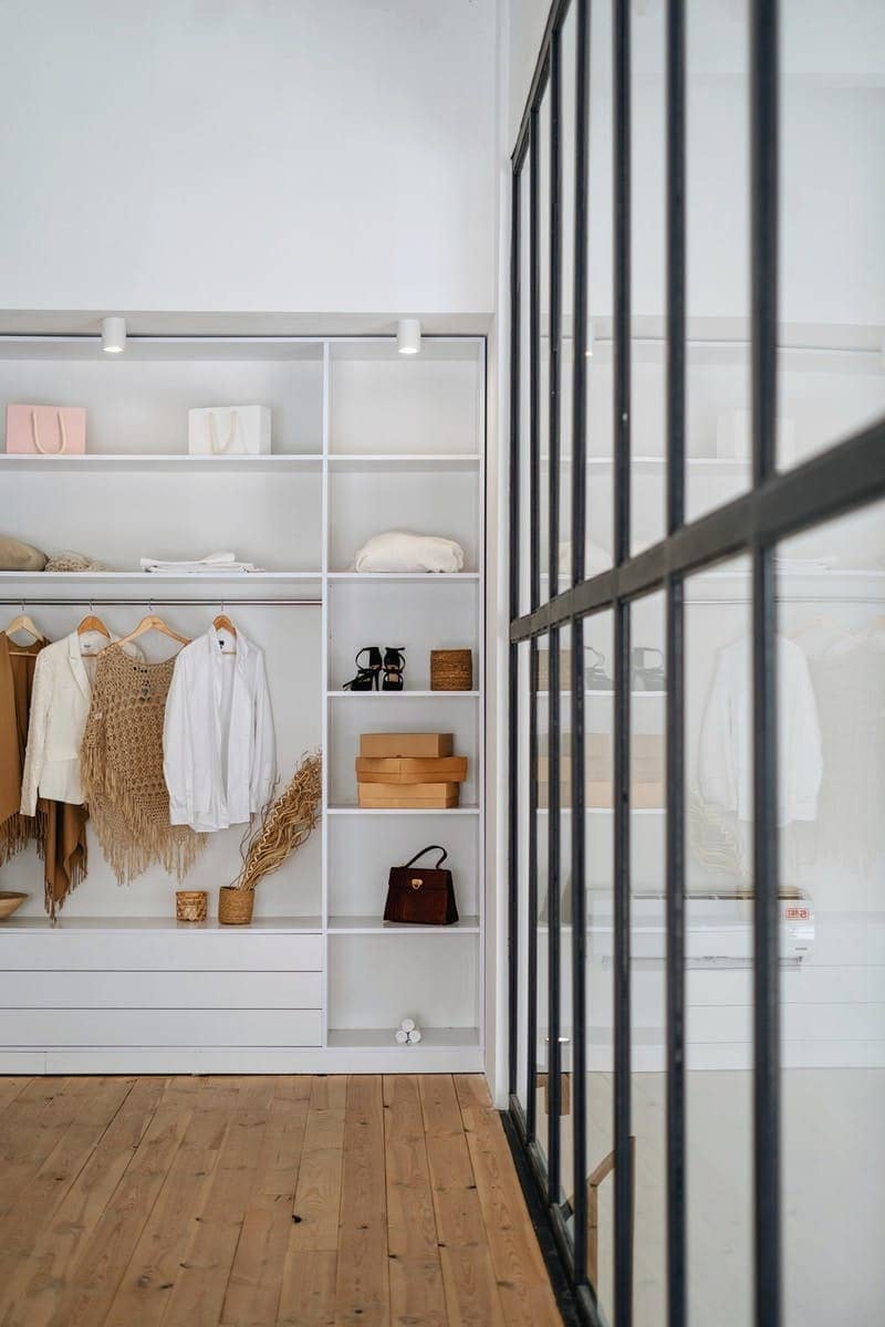 white bath towel on white wooden cabinet