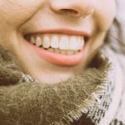 woman in white and black scarf