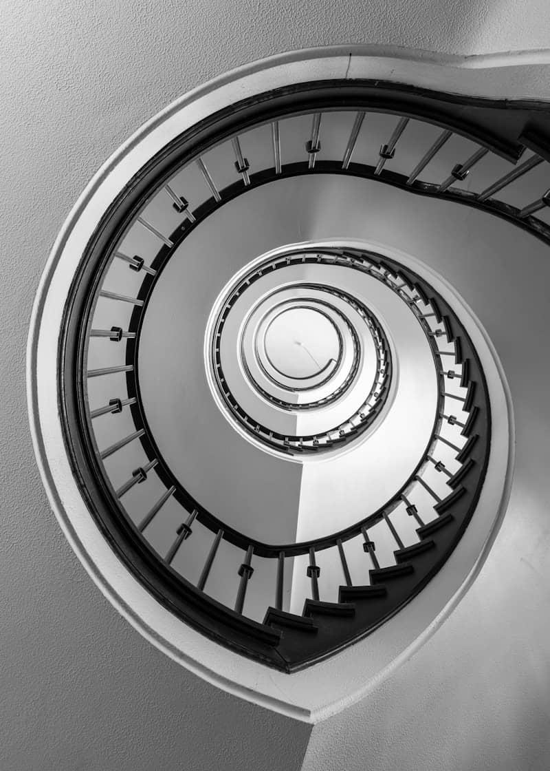 A spiral staircase viewed from below.