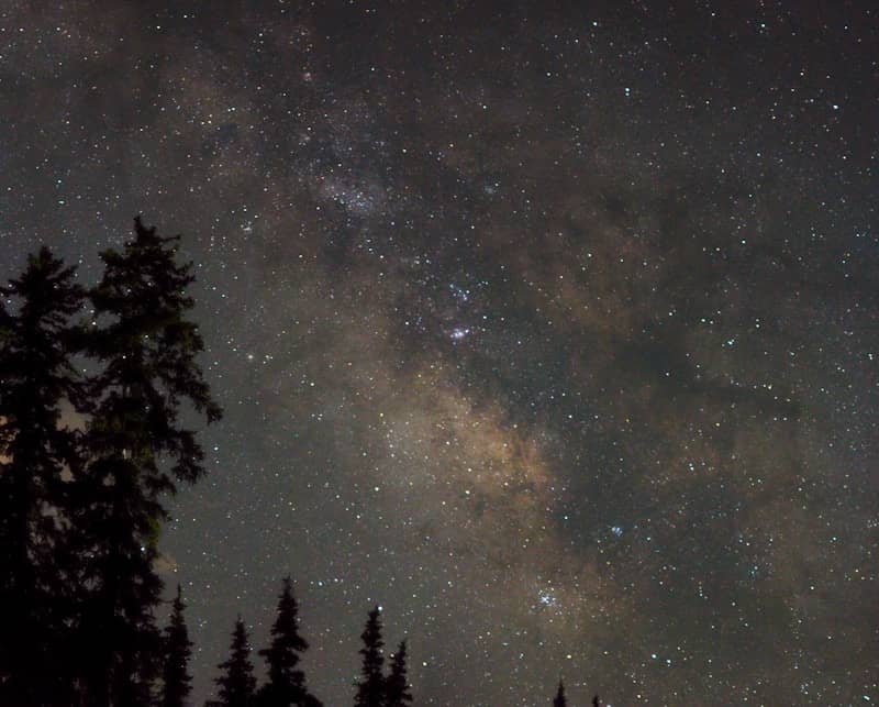 The milky way galaxy shines brightly in the night sky.