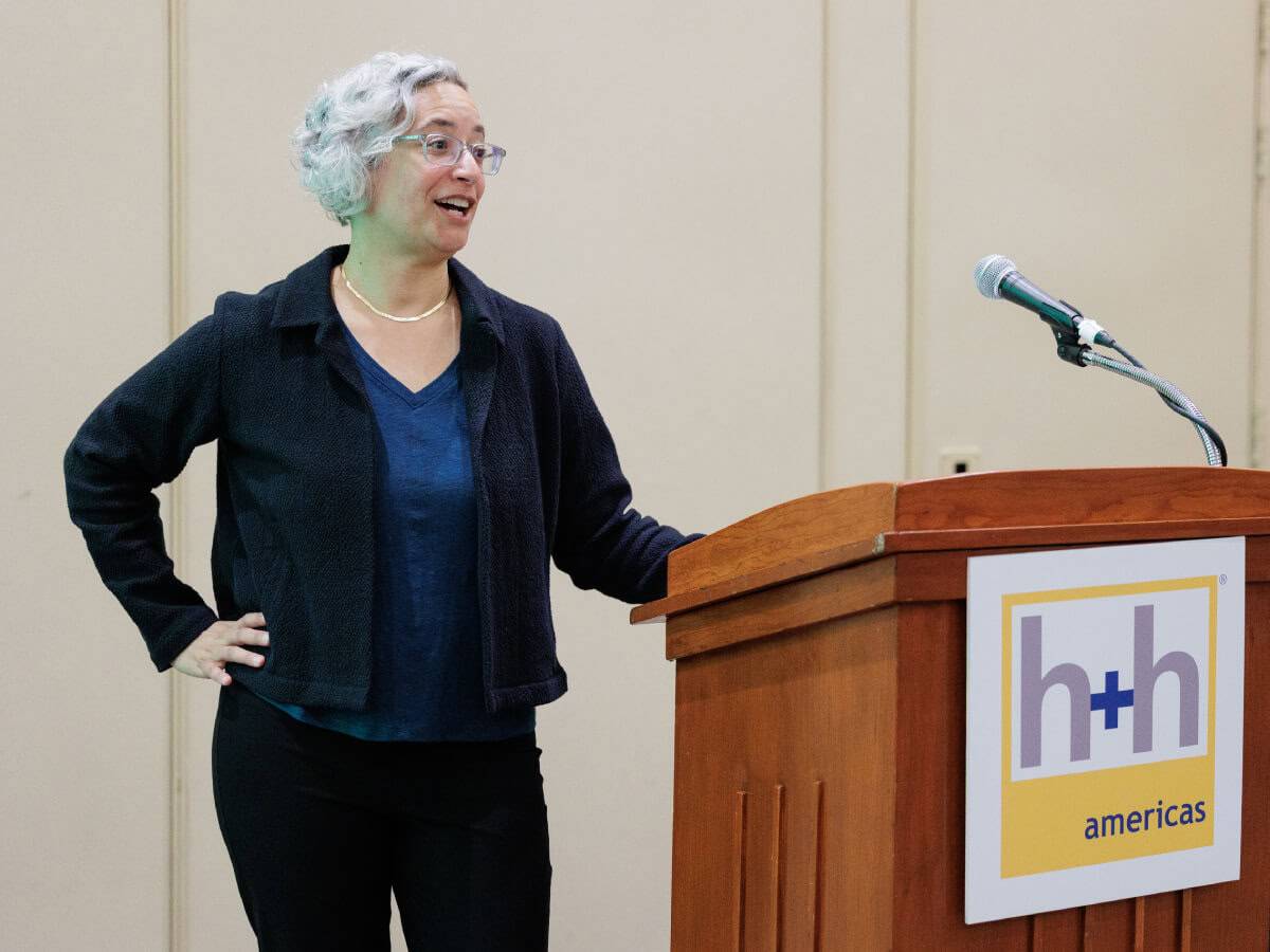 Arianne Foulks speaking at h+h americas