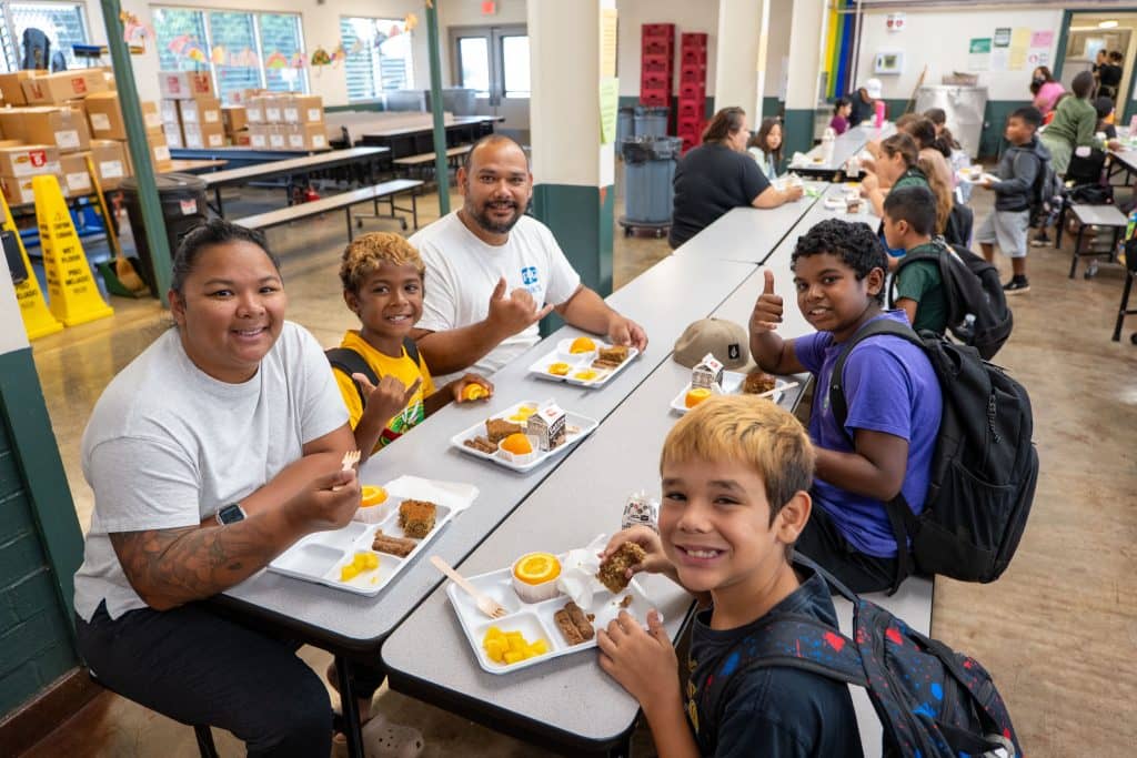 Students and parents at Helemano Elementary enjoy banana bread made with locally sourced ʻulu flour