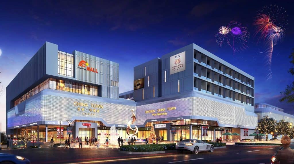 Steel frameworks rise at Port Moresby's Chinatown Phase 1 construction site, marking progress toward the city's first strata-titled commercial precinct set to open in September 2027.