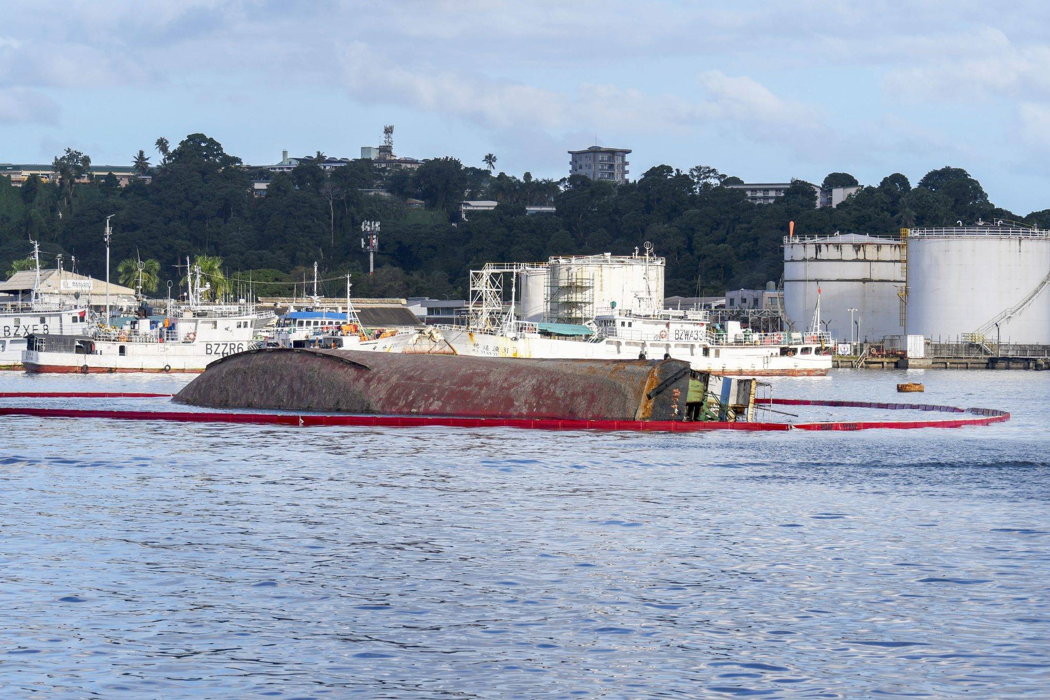 Fiji faces environmental crisis as oil spills from capsized ferry Lomaiviti Princess II in Suva Harbour, highlighting ongoing maritime safety concerns for Goundar Shipping operations.