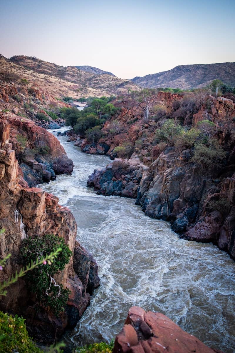 A powerful river flows through a rugged, rocky canyon.