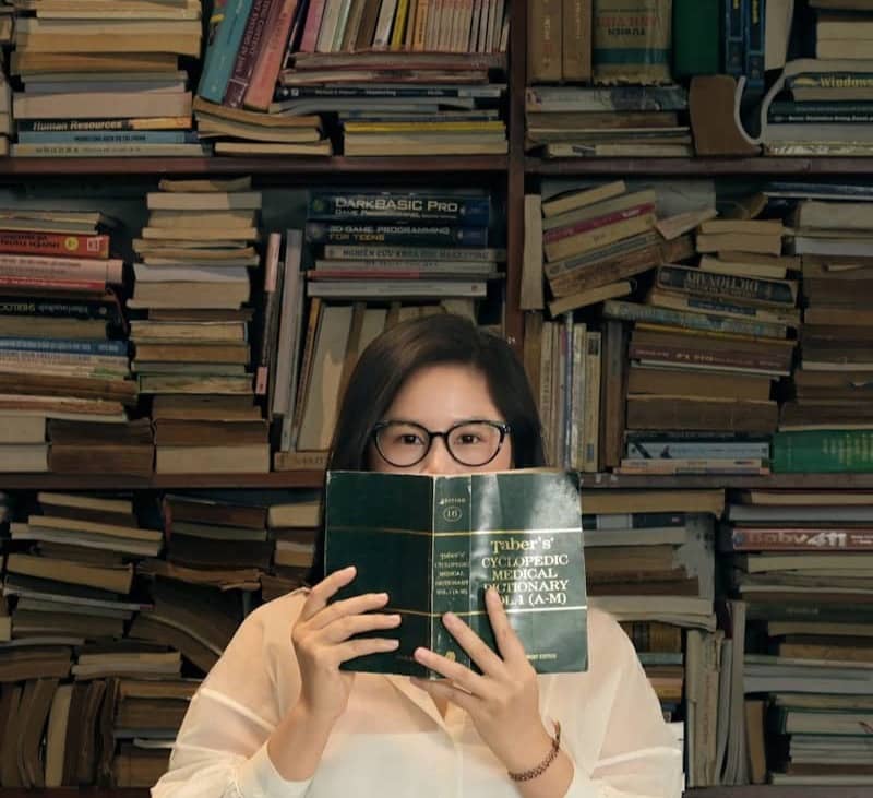 Woman surrounded by books