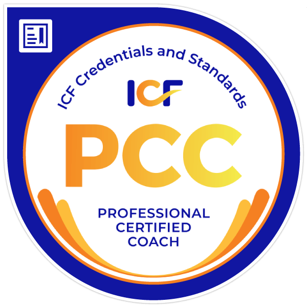 Round circle badge logo with bright blue rim. Orange and yellow lettering state: "PCC Professional Certified Coach."
