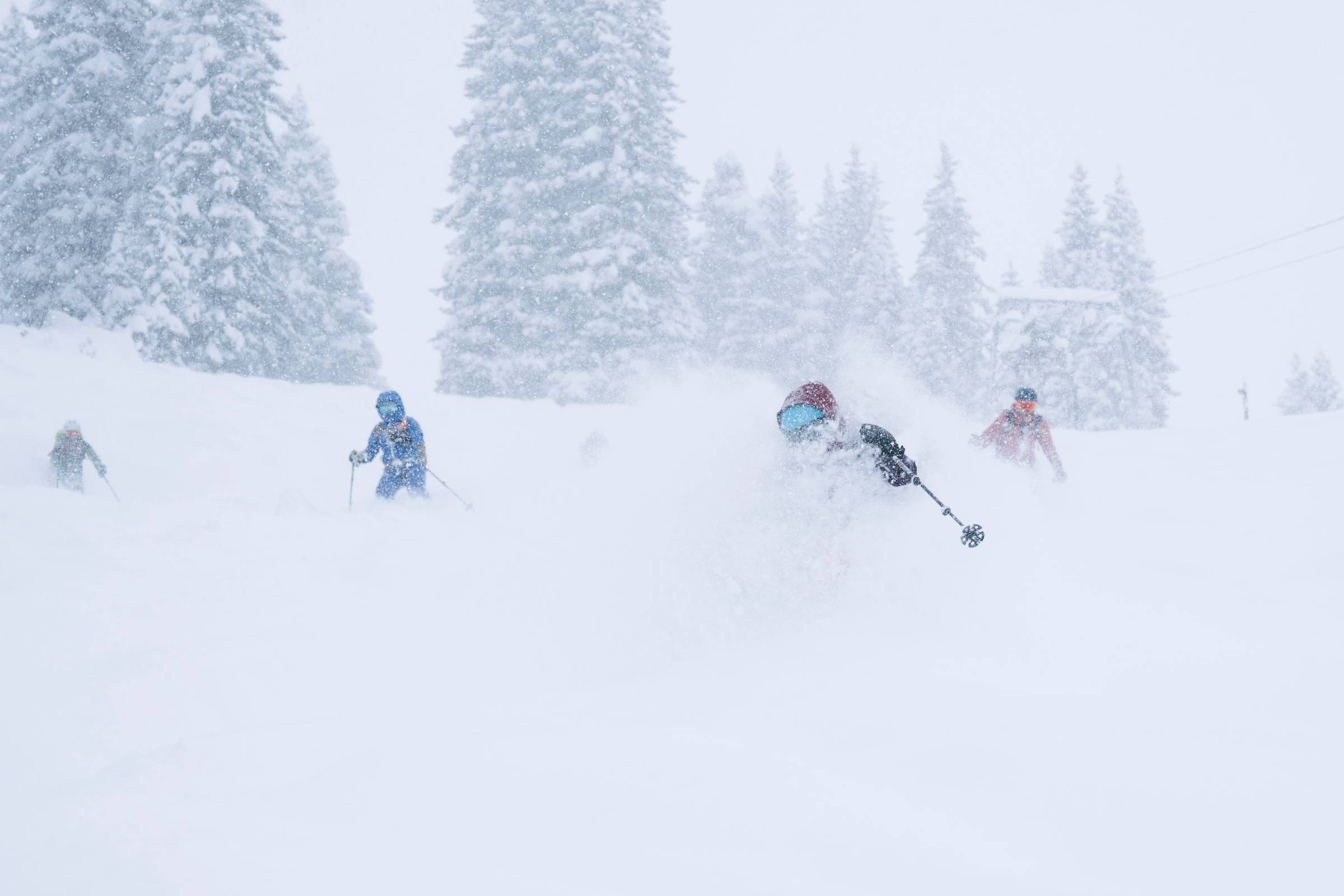 A group of skiers skiing powder in Lech am Arlberg