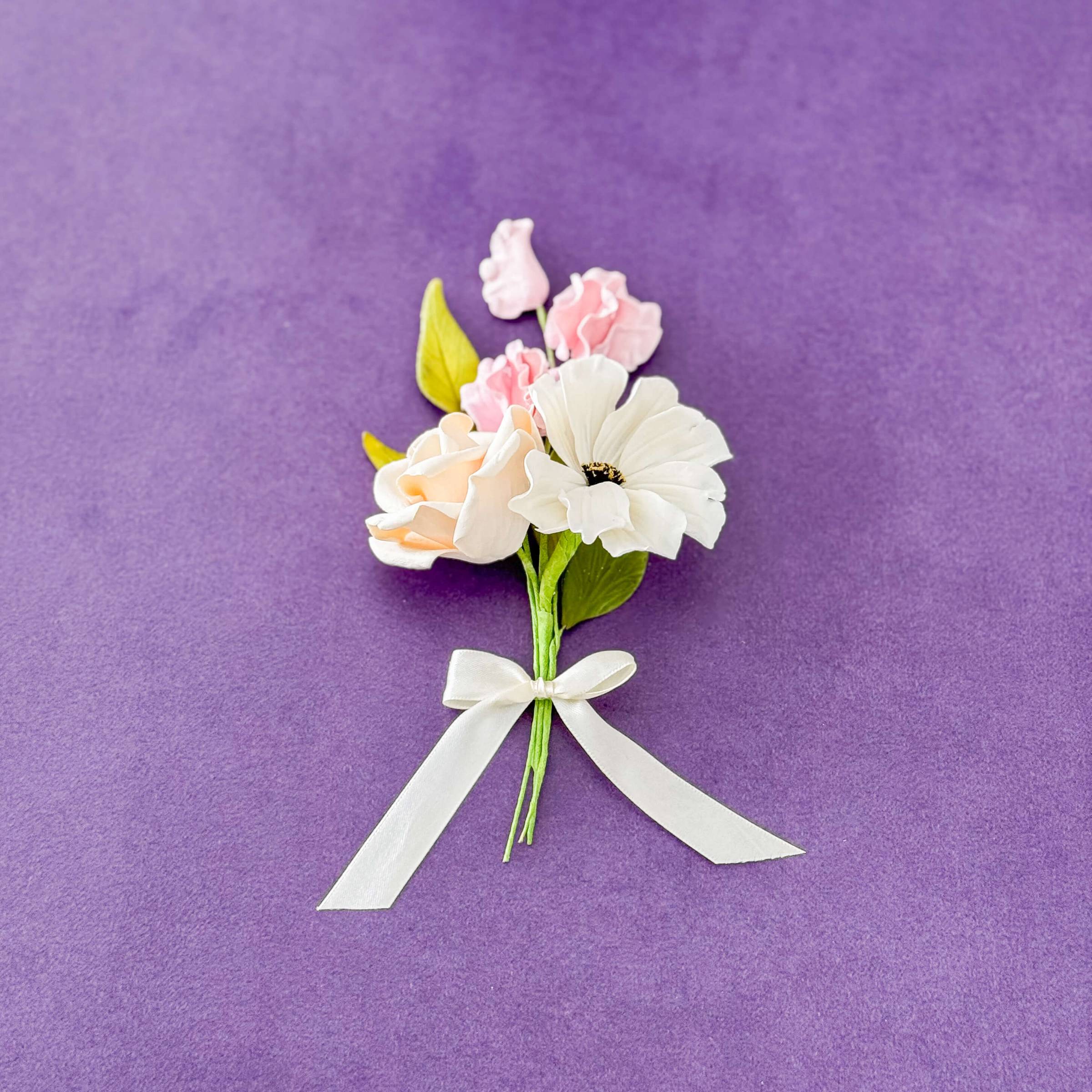 sugar flower posy with rose, cosmos, sweet pea, and leaves