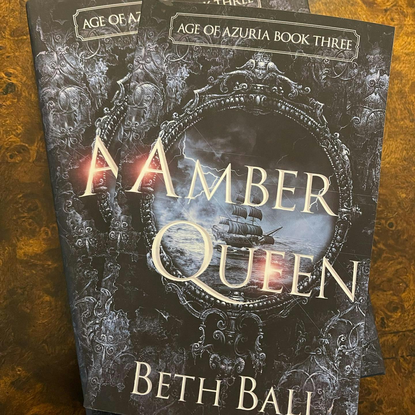 picture of two epic fantasy books, Amber Queen, Age of Azuria Book Three, by Beth Ball