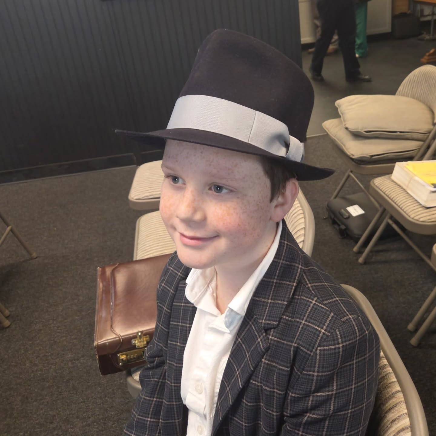 Teardrop fedora, 140g rabbit, midnight with light blue-gray ribbon.

I made this hat for a ten-year-old at my church. He picked the color of the felt, and I chose the ribbon and style. I had in mind matching it with his blue suit, but it works well with his other one, too.