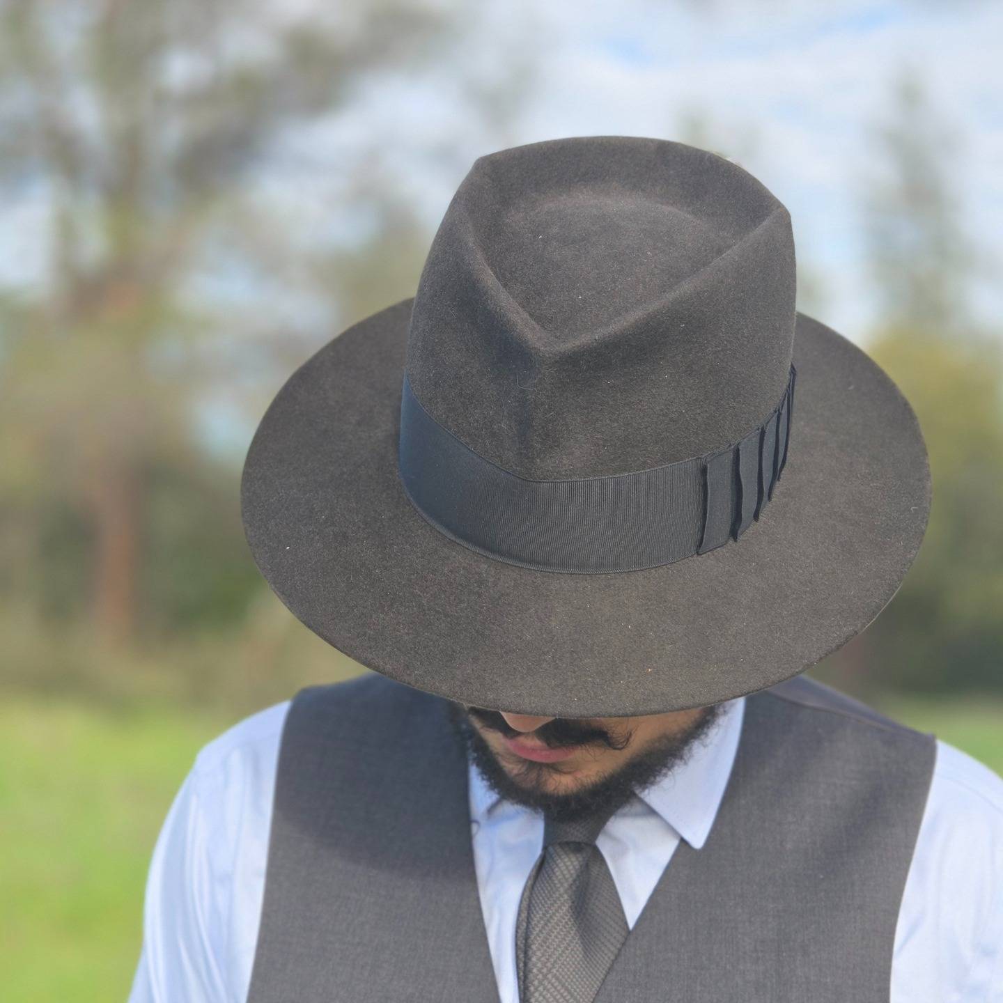 This is my adaptation of Humphrey Bogart's fedora in Casablanca, made to go with my new charcoal suit I got for my new job at King Law in Redding. It's 160g 100% rabbit in anthracite with a black ribbon, diamond crease, and shark gill bow.