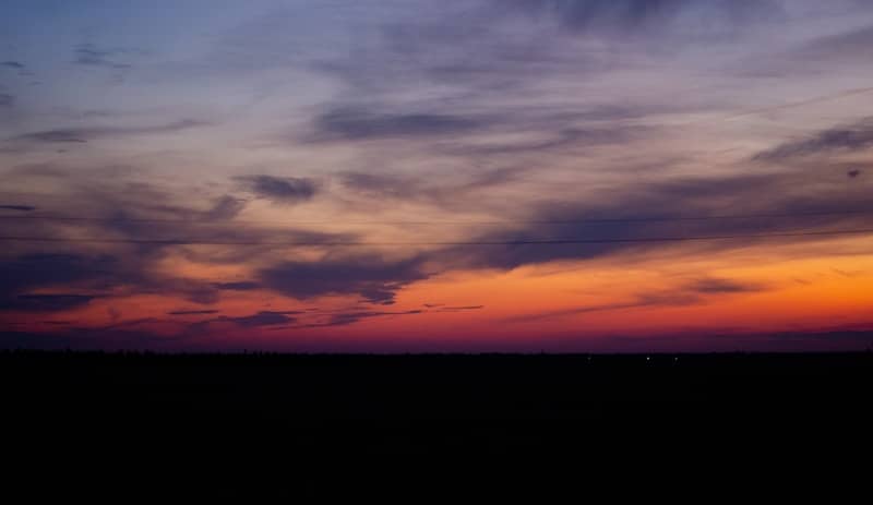 Colorful sunset paints the sky with vibrant hues.