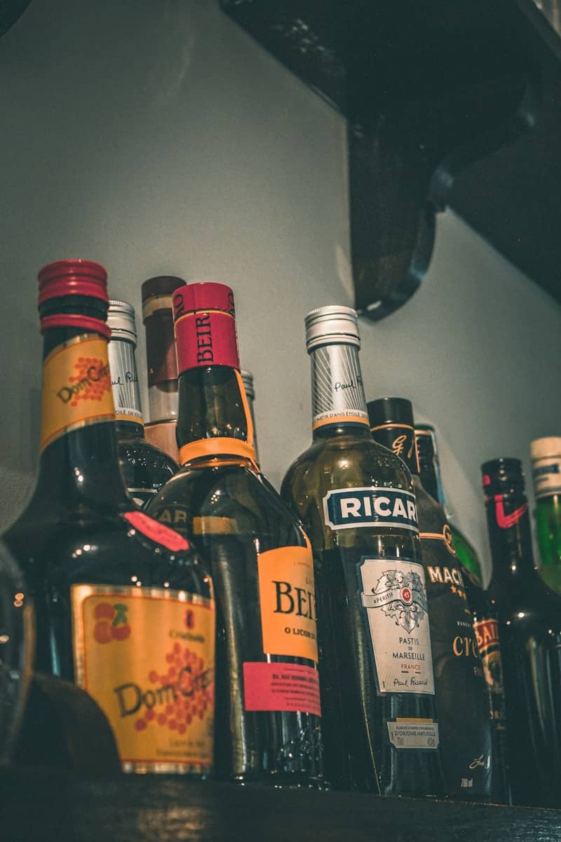 Assorted bottles of liquor on a shelf.