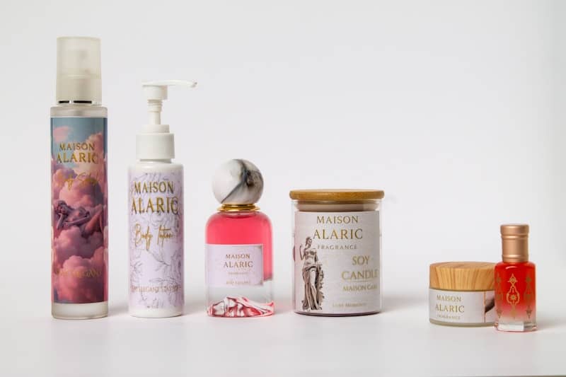 Assortment of maison alaric beauty products on a white background