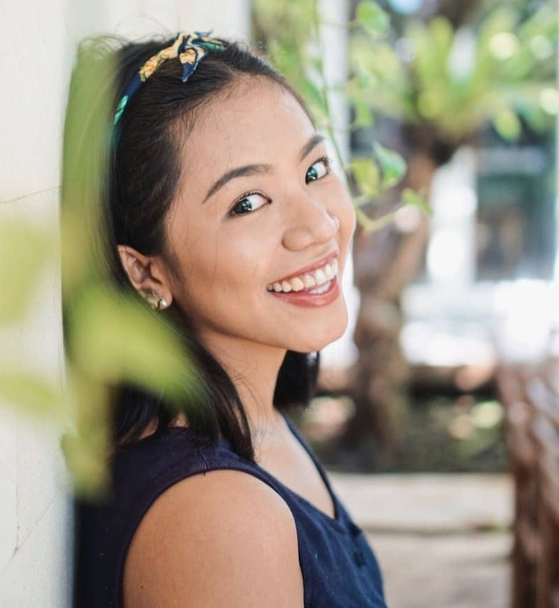 smiling woman in black shirt