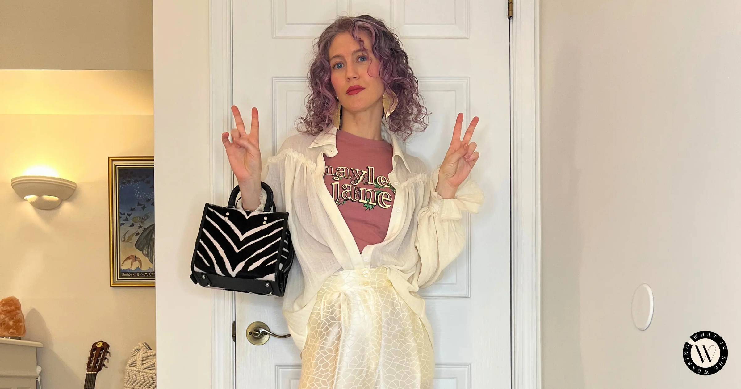 Woman modeling a boho chic band t-shirt outfit