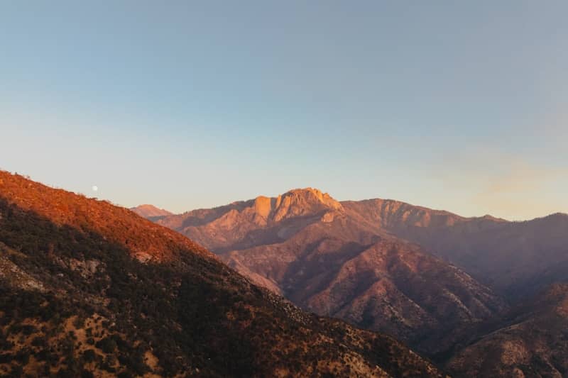 A view of a mountain range at sunset