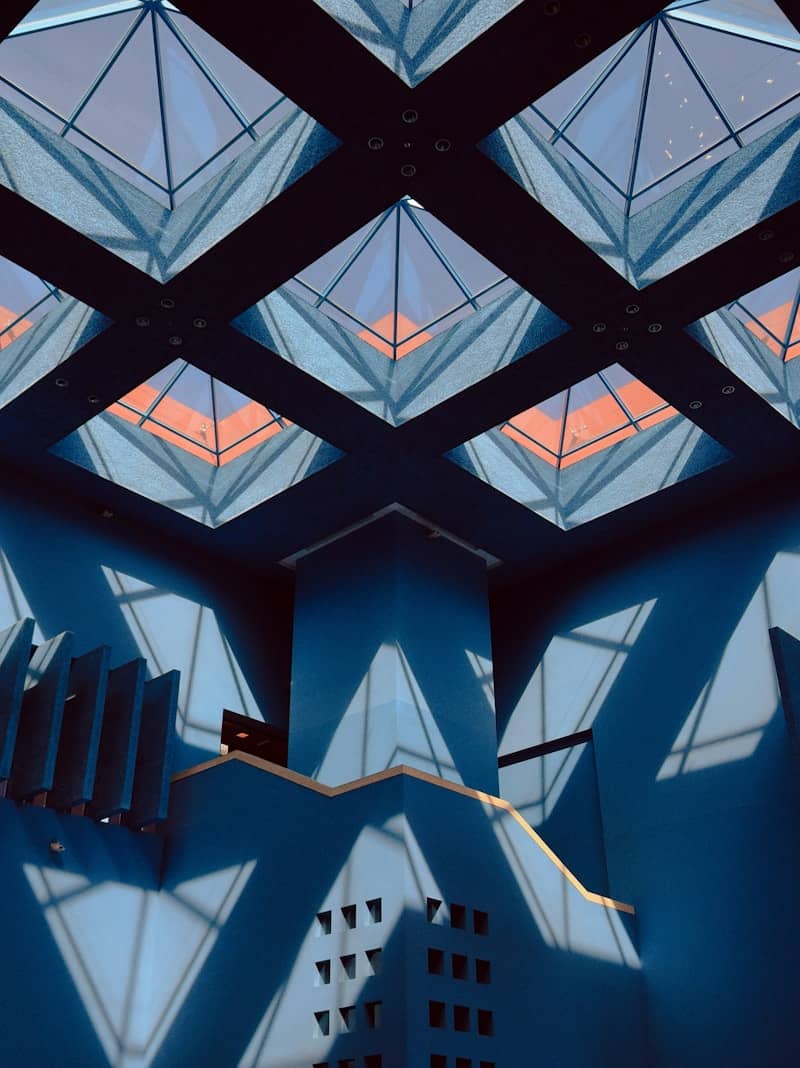 Blue interior with geometric shadows and skylights