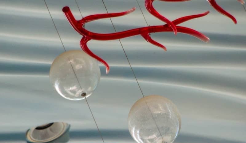 Red branches and clear spheres hanging