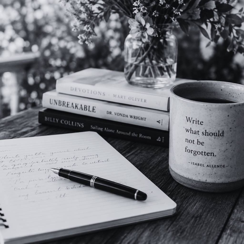 Journal with books and cup