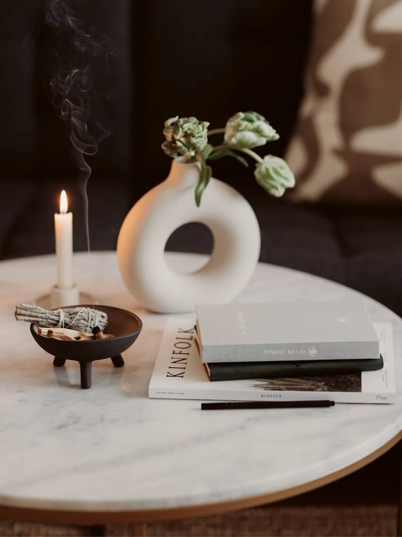 a vase with flowers on a table