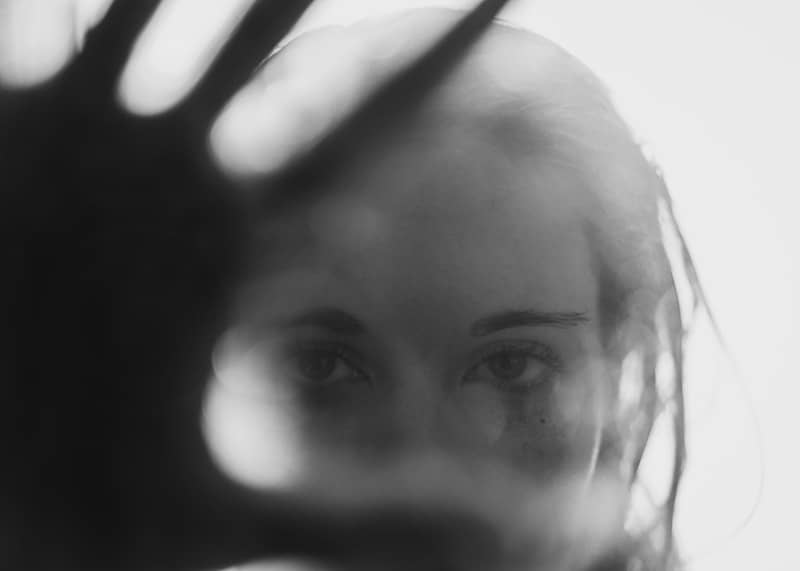 grayscale photo of womans face