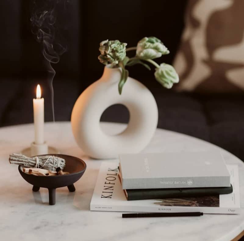 a vase with flowers on a table