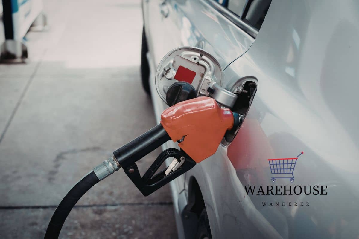 A gas pump filling a car 