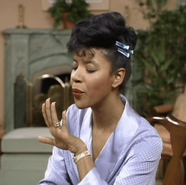 Clair Huxtable from Cosby Show blowing her nails after a manicure