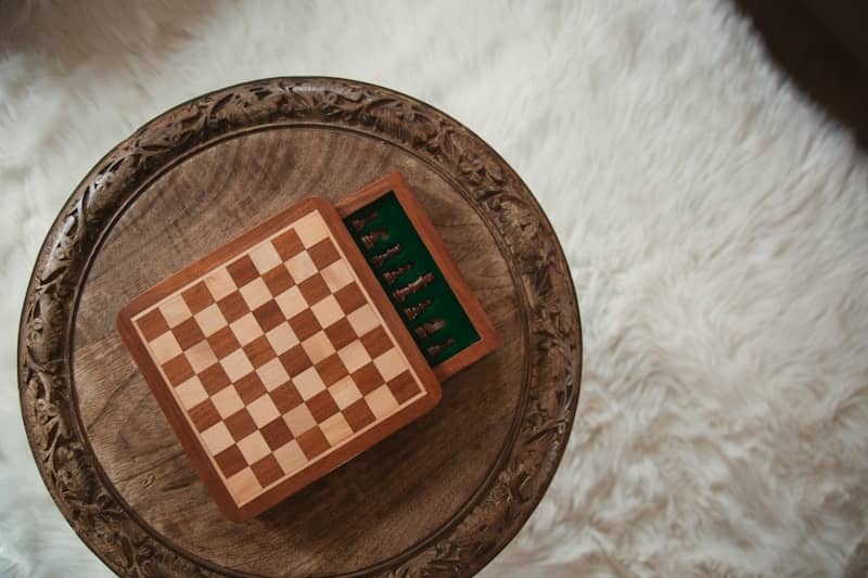 A small chess set sits open on a table.