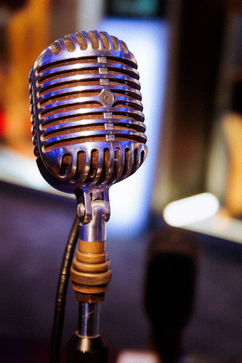 A vintage microphone stands ready for the show.