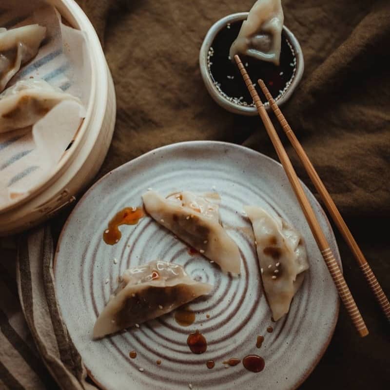 white ceramic plate with food on black textile