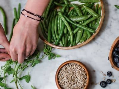 Preparing a green bean salad.