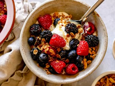 Greek yogurt topped with berries and granola